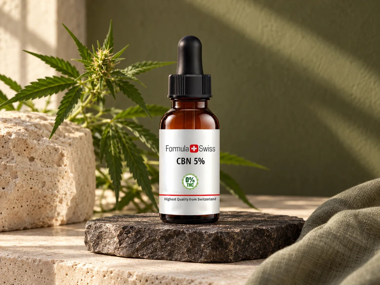 Formula Swiss CBN 5% oil bottle on stone beside organically grown hemp